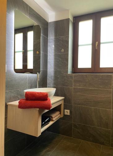 a bathroom with a sink and a mirror at Casa Gecko in Tijarafe