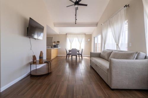 a living room with a couch and a table at New Casa Marea #2 Beach Front House 2BR Wifi AC in Colonia Cuauhtemoc