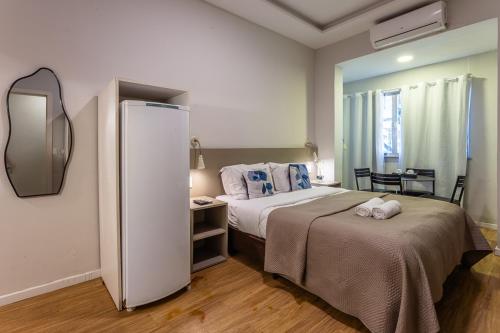 Postel nebo postele na pokoji v ubytování Injoy Lofts & Studios Ipanema