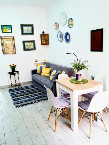 a living room with a couch and a table at Apartamentos Lax in Almería