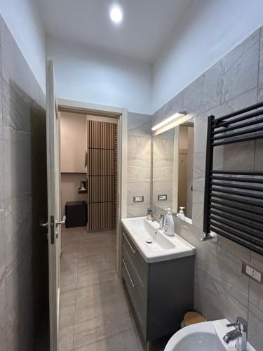 a bathroom with a sink and a toilet at International Naples in Naples