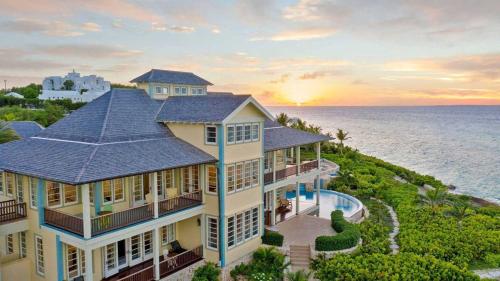 an aerial view of a house with the ocean in the background at Villa Oasis Anguilla in Long Bay Village