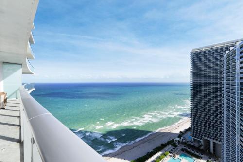 a view of the ocean from the balcony of a building at Luxury Oceanview Condo at Lyfe Resort - STEPS TO THE OCEAN, HOT TUB AND ROOFTOP POOL in Hollywood