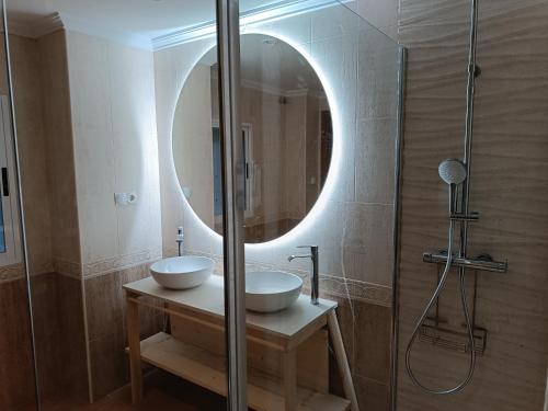 a bathroom with a sink and a mirror at Casa Caldereta in Ayelo de Rugat