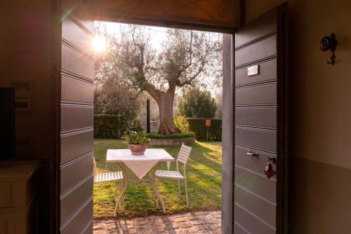 a door leading into a patio with a table outside at Marica in Pesaro