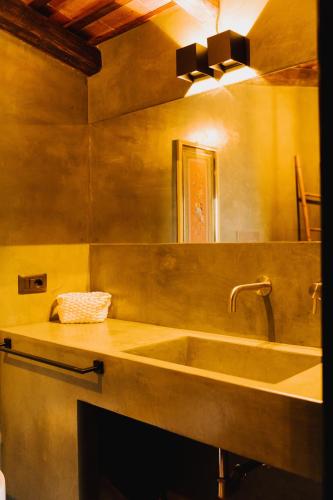 a bathroom with a sink and a mirror at QUIETE e MARE in San Vito lo Capo