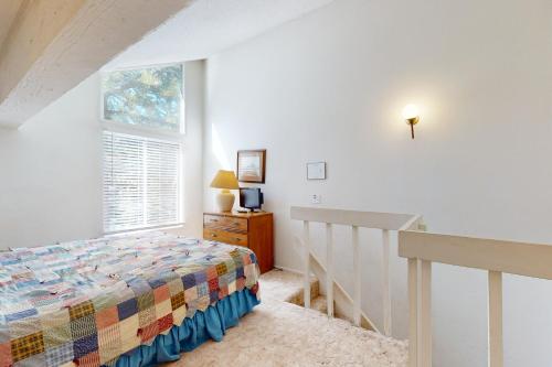 a bedroom with a bed and a window at Hidden Valley 30 D in Mammoth Lakes