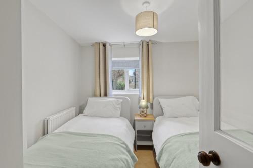 Ένα ή περισσότερα κρεβάτια σε δωμάτιο στο Coria House - North East Escape