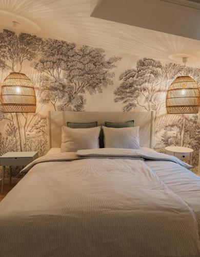 Ένα ή περισσότερα κρεβάτια σε δωμάτιο στο Apartamenty Guzik 31