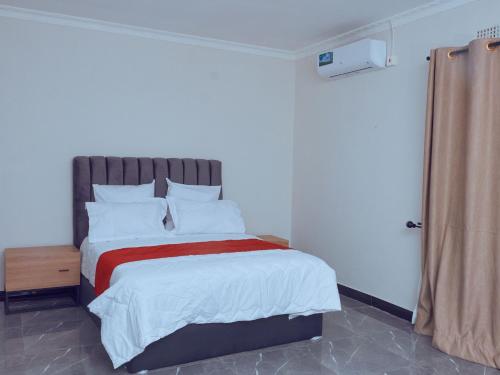 Postel nebo postele na pokoji v ubytování Rosh Pina Court