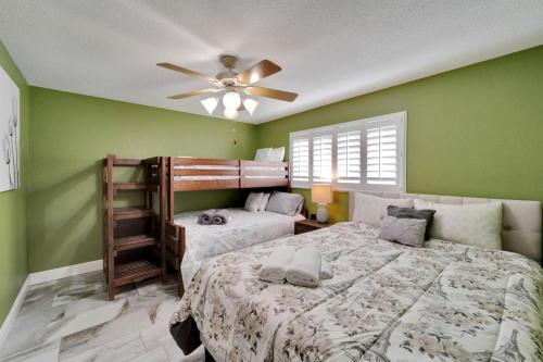 a bedroom with two beds and a ceiling fan at Water front in Clearwater in Clearwater