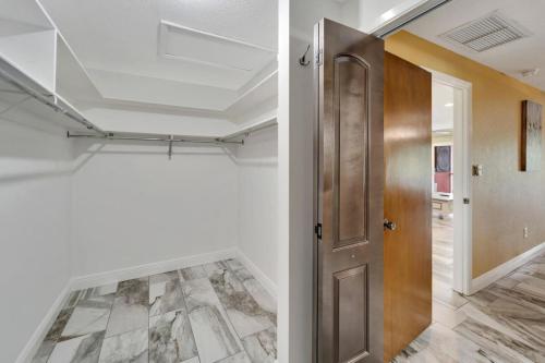 a hallway with a door and a tile floor at Water front in Clearwater in Clearwater