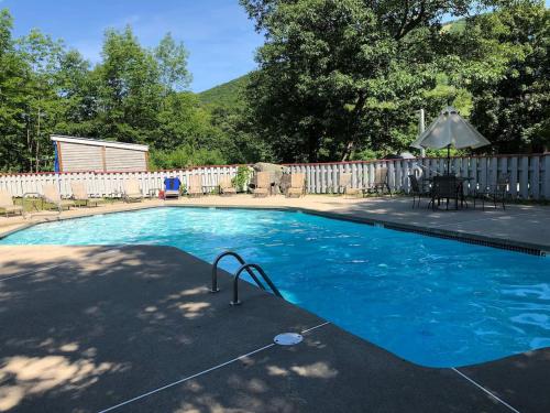 a swimming pool in a yard with a fence at Studio Apt with stunning Mountain Views in Lincoln