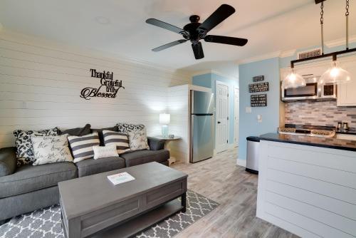 a living room with a couch and a ceiling fan at Pool and Direct Beach Access Corpus Christi Escape in Corpus Christi