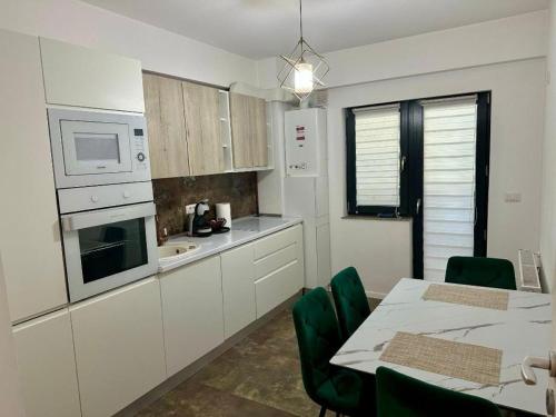 Η κουζίνα ή μικρή κουζίνα στο Apartament Daniela