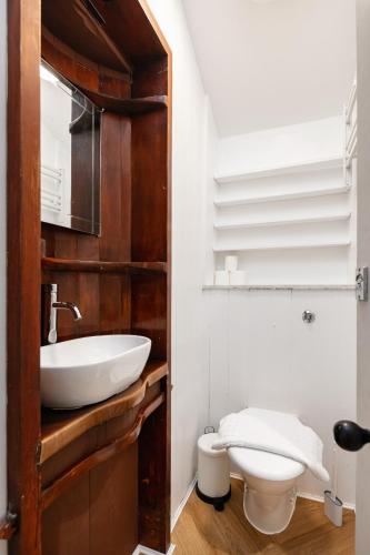 a bathroom with a sink and a toilet at The Portobello Collection in London