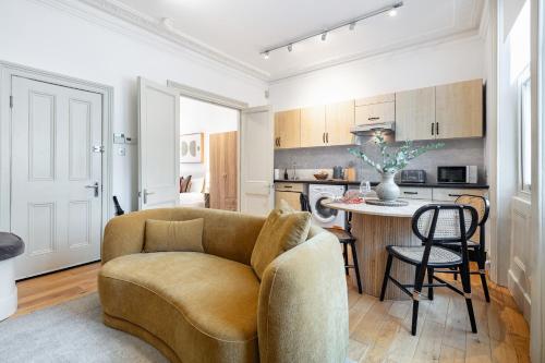 a living room with a couch and a table at The Portobello Collection in London