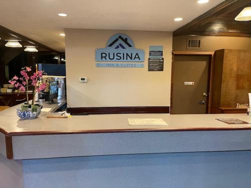 a rinska sign on the wall of a building at Rusina Inn in Colorado Springs