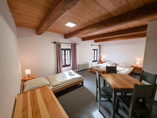 Postel nebo postele na pokoji v ubytování Pivovar Mlýn