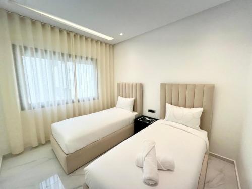 Ένα ή περισσότερα κρεβάτια σε δωμάτιο στο Bright Minimalist 2 Bedrooms - Beach Access