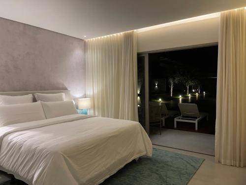 Ένα ή περισσότερα κρεβάτια σε δωμάτιο στο Île Lumière