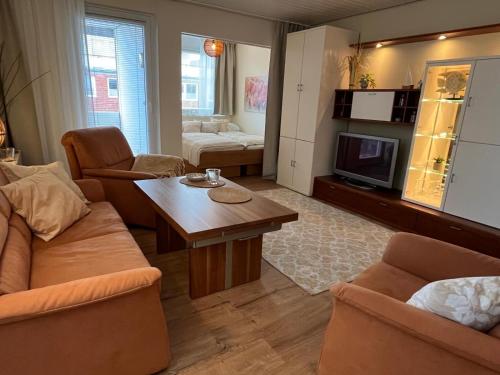 a living room with a couch and a table at Ferienwohnung Reede 19 in Butjadingen