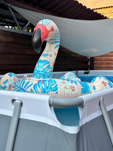 a toy pelican sitting on top of a boat at Банний Двір in Kryvyi Rih