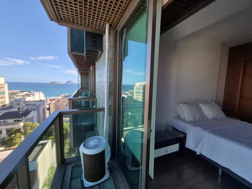 Una cama o camas en una habitación de TIFFANYs RIO FLAT