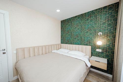 Llit o llits en una habitació de Central Modern Apartment
