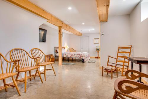 a room with chairs and a bed with a table at Direct Lake Access! Quiet Waukewan Retreat in Winona