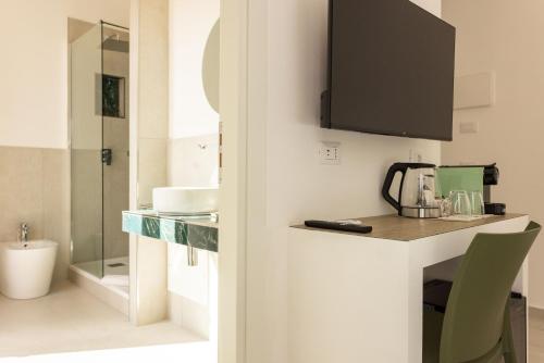 TV a/nebo společenská místnost v ubytování URBAN Palermo DOWNTOWN