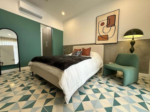 a bedroom with a bed and a chair at Stunning 1BR in Santa Ana Best Area in Panama City
