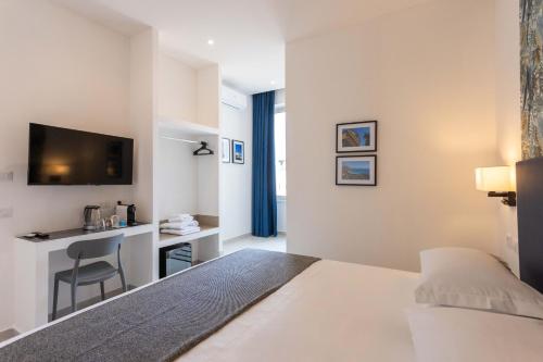 Postel nebo postele na pokoji v ubytování URBAN Palermo DOWNTOWN