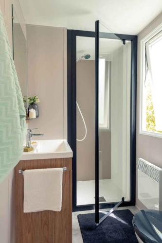 a bathroom with a shower and a sink at Camping Papillon Kinrooi - 86 in Kinrooi