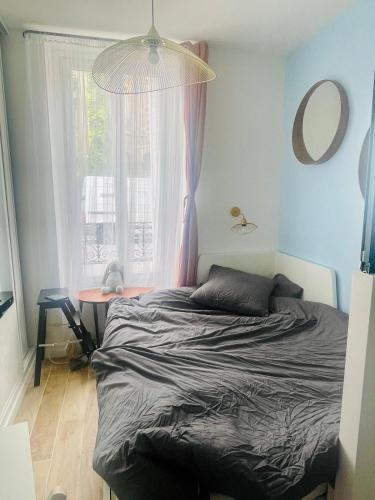 Postel nebo postele na pokoji v ubytování Jin cosy studio