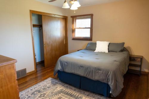 a small bedroom with a bed in a room at Convenient Countryside Oasis in Caledonia