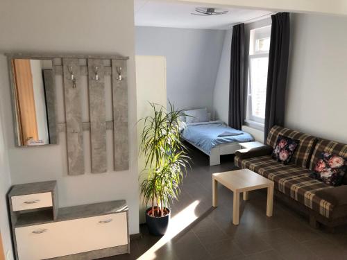 a living room with a couch and a table at Kleve-Kellen 2 in Kleve