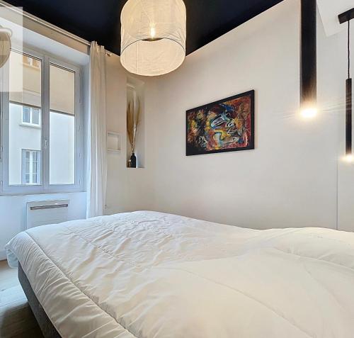 Giường trong phòng chung tại l atypique d Édouard