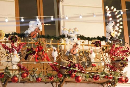 a display of christmas ornaments on a table at Homzy Craiova in Craiova