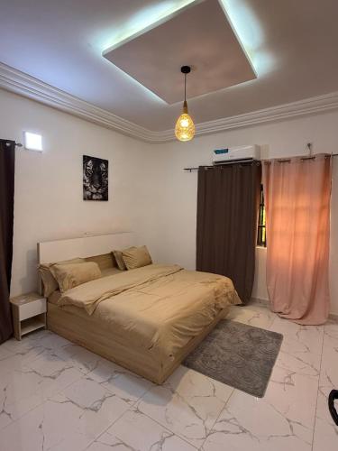 Ένα ή περισσότερα κρεβάτια σε δωμάτιο στο Élégance Urbaine Lomé