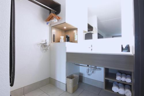 a bathroom with a sink and a mirror at Best Western Point South in Yemassee