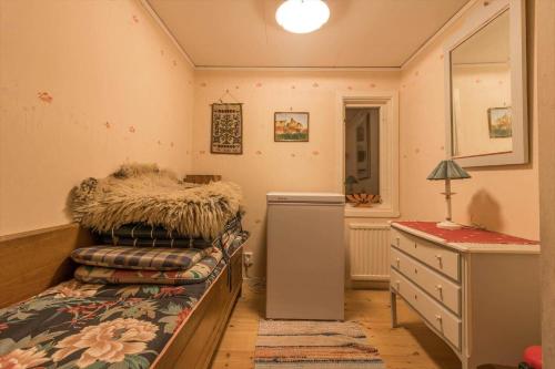 a bedroom with a bed with a dresser and a desk at VGO860-Tranemo-Ryda-Ryfors-kvarn-1 in Östra Ryda