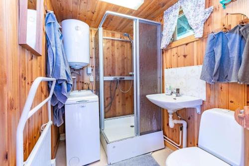 a bathroom with a shower and a toilet and a sink at VAR799-Torsby-Bada-125-a in Klätten