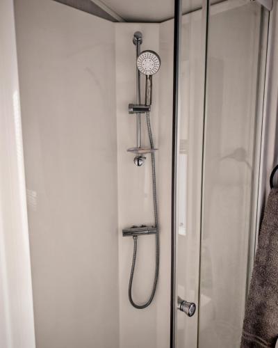 a shower in a bathroom next to a shower at Primrose Valley Primrose field 4 in Filey