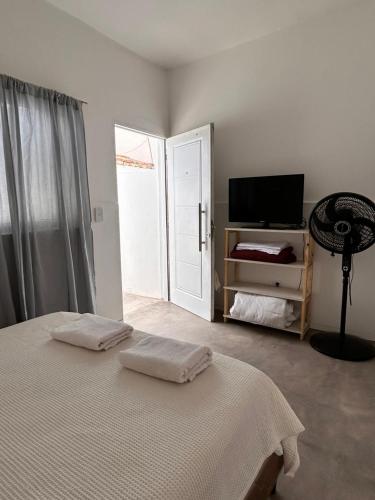 Ένα ή περισσότερα κρεβάτια σε δωμάτιο στο Los Olivos Apart