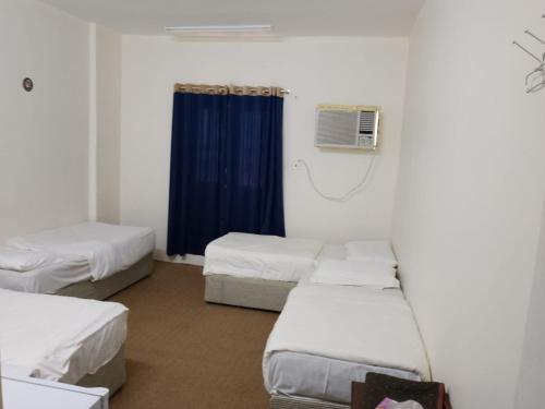 Postel nebo postele na pokoji v ubytování Hotel Dar Al-Ashraf Madina