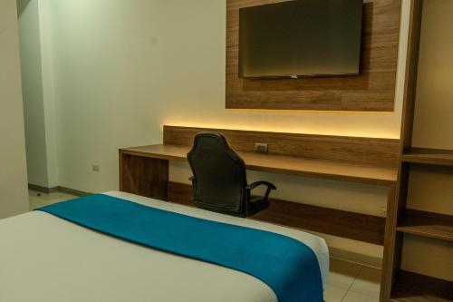 a hotel room with a bed and a television at Antawa Classic in Moquegua