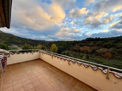a balcony with a view of the mountains at Hostal Todolella in Todolella