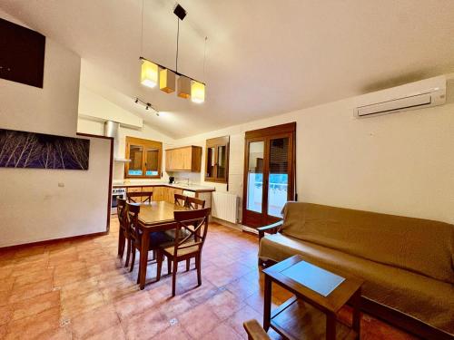 a living room with a couch and a table at Hostal Todolella in Todolella