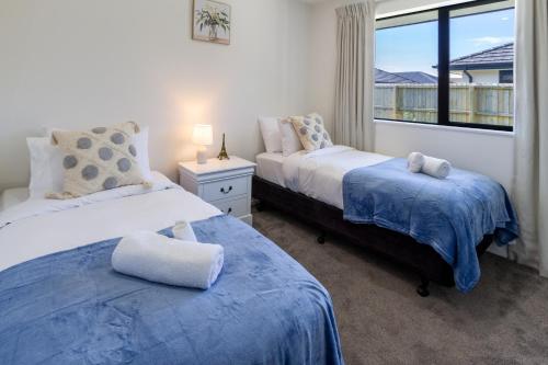 Postel nebo postele na pokoji v ubytování Halswell Quarry - Walk and Explore - 3 bed